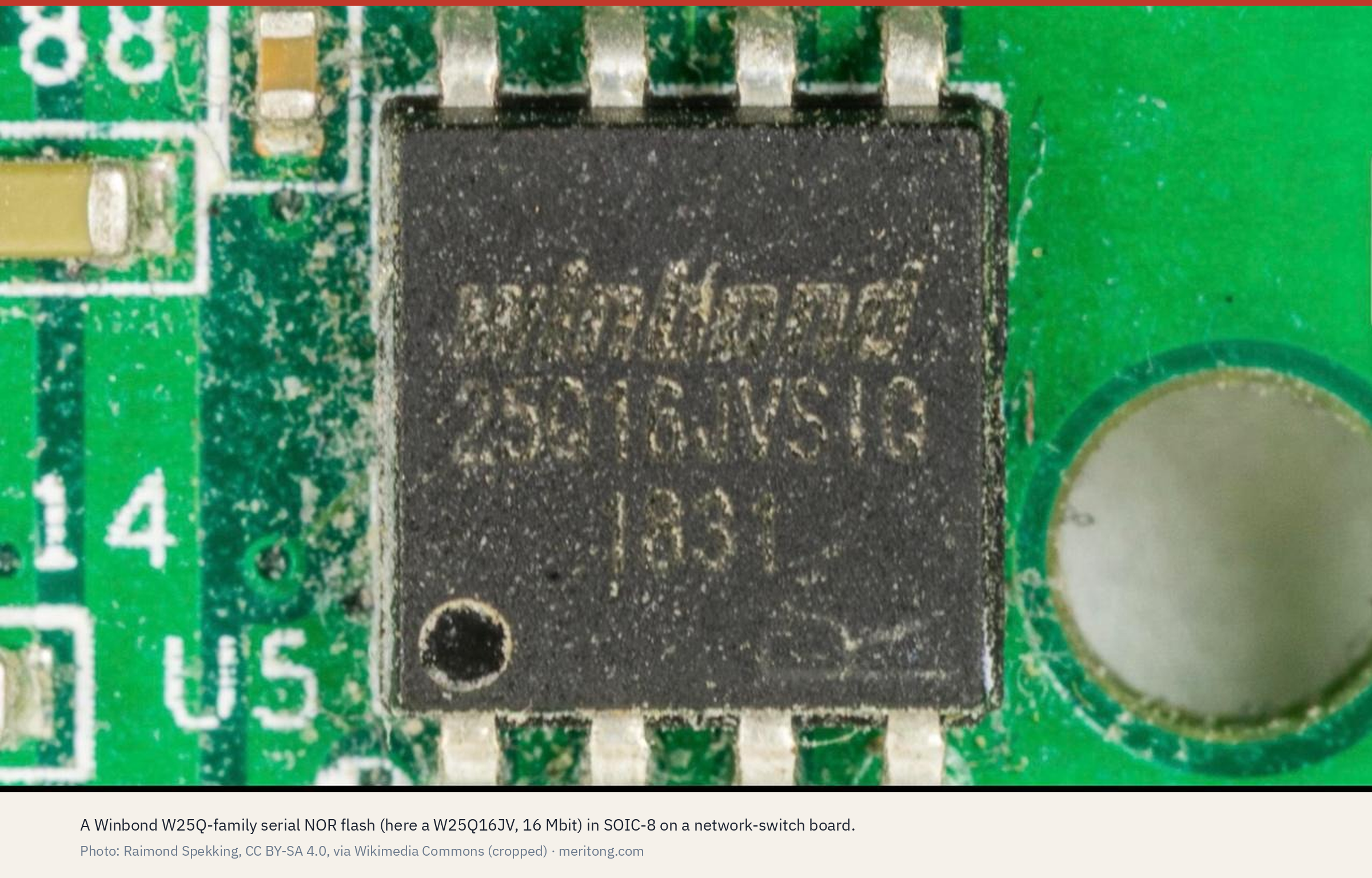 A Winbond W25Q-family serial NOR flash in SOIC-8 on a network-switch board. Photo: Raimond Spekking, CC BY-SA 4.0, via Wikimedia Commons, cropped